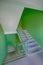 Building panel house interior with flight stairs and green walls. flight of stairs in a high-rise building. Stairs going