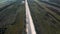 building roads. Aerial flight above new highway lane under construction.