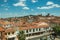 Building roofs, church bell towers and empty street at Caceres