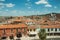 Building roofs, church bell towers and empty street at Caceres