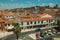 Building roofs, church bell towers and empty street at Caceres