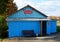 The building of a single-storey wooden rural shop of the Russian province