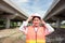 At a building site, a confident female construction worker poses for a portrait