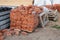 Building site with stack of bricks, wood, concrete blocks