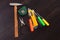 Building tools on wooden background, repair kit, bright screwdrivers, hammer, utility knife,