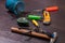 Building tools on wooden background, repair kit, bright screwdrivers, hammer, utility knife,