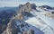 Building on a top of a rock and ski tracks on a glacier in mountains