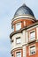 Building with a tower and domed roof. Spanish architecture.