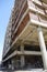 Building under construction against blue sky. General view of the construction of a new residential complex. Partially constructed