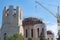 The Building Under Construction and The Dome of the Russian Orthodox Church Are Surrounded by Demountable Scaffolding and