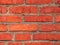 Building wall of red brick. Brickwork. Textured background
