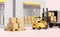 Building warehouse with forklift for import export,goods cardboard box, pallet,truck isolated on pink background,logistic service