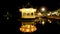 Building on the water, Chinese garden lights at night.