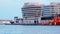 Building world trade center in Barcelona City. Fishing ship standing in sea port