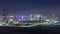 Buildings on Al Reem island in Abu Dhabi night from above.