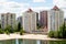 Buildings with beach and river or pond.