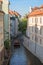 Buildings, boat and canal in Prague