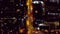 Buildings, city and drone, street and night with travel, property and infrastructure. Urban landscape, architecture and
