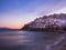 Buildings on the cliff and ancient fortress on the hill near the coastline