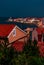 Buildings, embankment, cape in Piran before storm, night