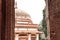 Buildings framed by doorway and window at the anciet Qutub Minar complex in New Delhi India