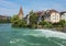 Buildings of the historical part of the town of Bremgarten along the Reuss river in summertime