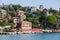 Buildings on the Ligurian coast. Houses overlooking the sea, hotels and bathing establishments for the summer in Italy