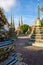 Buildings and many ornate chedis at the Wat Pho temple in Bangkok during a sunny day