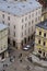 Buildings and people walking on the Rynok square, the centre of Lvov, top view