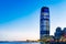 Buildings and piers by Hudson River under blue sky in Jersey Cit