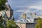 Buildings from Quebec in Canada, with a background of blue sky and rainbow. Concept of tourism and real estate