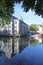 Buildings reflected in the River Dart at Totnes