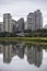 Buildings reflected in river waters