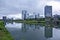 Buildings reflected in river waters