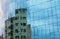 buildings reflected in windows