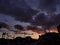 Buildings silhouette in cloudy sunset