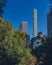 Buildings and skyscrapers of midtown Manhattan above trees, viewed from Central Park of New York City, USA