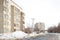 Buildings on the street in winter ,trees in the circle of houses