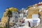 Buildings tumble down the cliff side in the village of Oia, Santorini