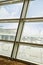 Buildings viewed through window of Shimla Airport