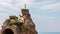 Built by Napoleon`s order, a local landmark of Biarritz city Rocher De La Vierge in shape of tongue with statue of Virgin Mary