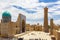 Bukhara - a view on the square at the Kalyan Minaret and Mosque with groups of tourists