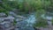 Buki village canyon, flying over the river and rocks.