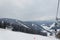 BUKOVEL, UKRAINE - FEBRUARY 28, 2018 Panoramic view of the ski slope, chairlift and mountains in Ukraine, Carpathian mountains reg