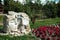 Bukovel, Ukraine - July 2020: Typical sculpture of Ukrainian couple in a rural village. Two big head statues surrounded by nature