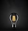 Bulb on Black background With Copy space in upper side