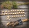 Bulbs Allium aflatunense on a wooden background