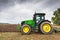 Bulgaria - August 22th,2015: Ploughing a field with John Deere