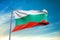Bulgaria flag waving against clean blue sky, close up