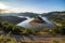 Bulgaria, Kardzhali dam, panoramic view of meander in Arda river, surrounded with green forest, summer time during sunset.